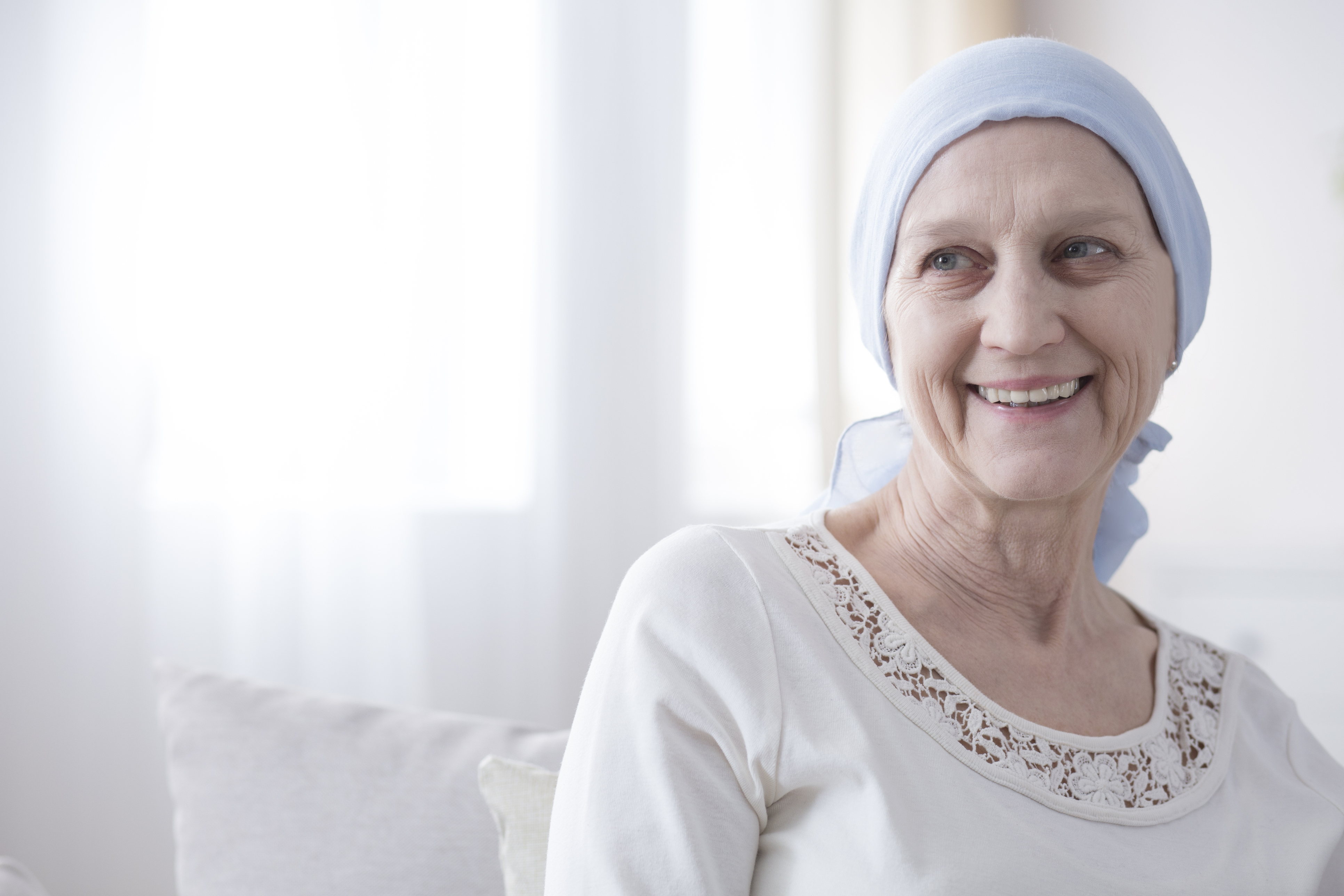 This is a picture of a woman wearing all white with a white headscarf.